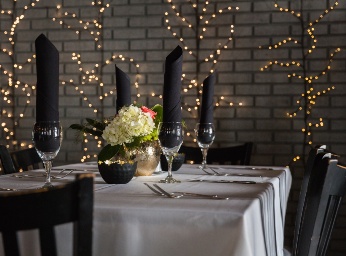 Interior of Evangeline's white table cloth establishment in Tuscaloosa, Alabama.
